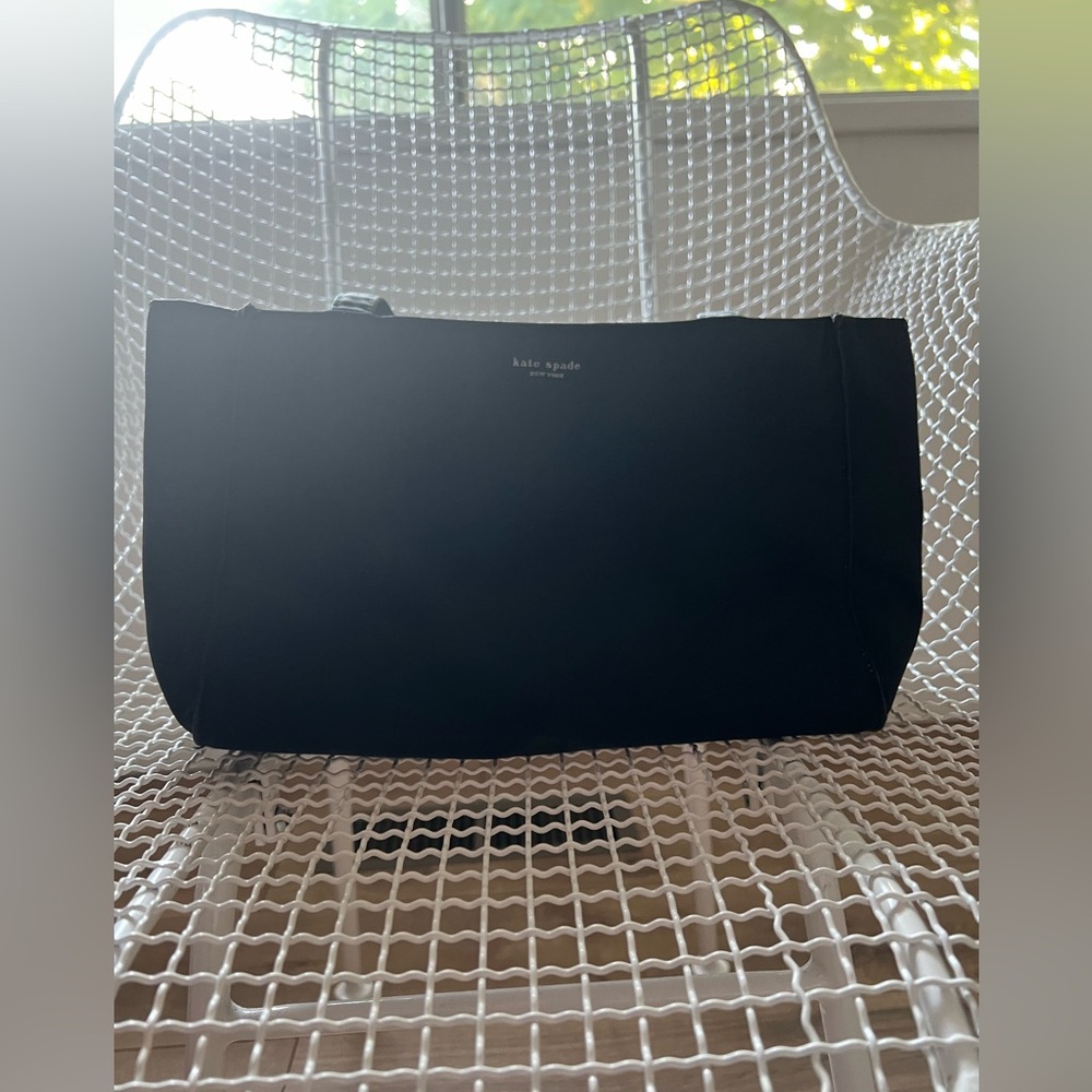 Small, vintage kate spade fabric/nylon hand bag in black. Magnetic snap close.